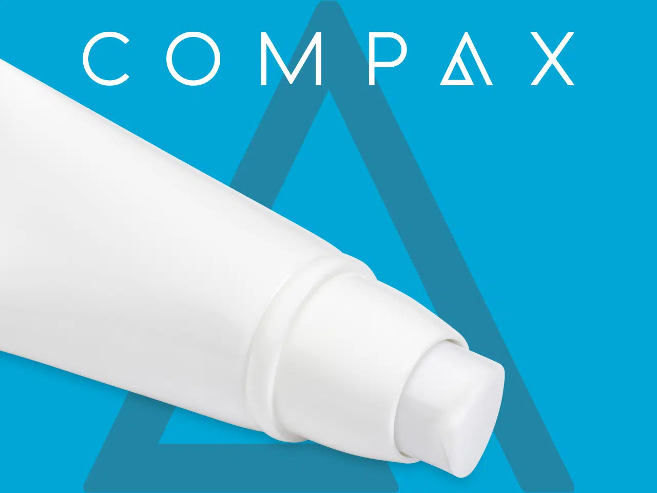 Close-up of a white tube against a blue background with the text "COMPAX" above it. The tube is likely to contain a cosmetic or medical product. The background features a faint triangular design.