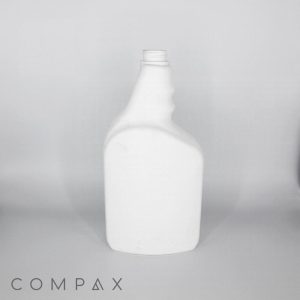 A white, empty, plastic bottle with a curved neck and a missing cap is placed against a plain background. The word "COMPAX" is marked in the bottom-left corner of the image.
