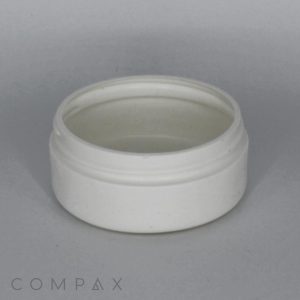A small white plastic screw cap or lid, removed from its container, sits upright on a light gray surface. The edges are threaded, indicating it can be screwed onto a matching container.