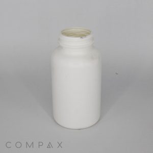 A plain white, cylindrical plastic bottle with a wide mouth and a screw-on cap rests on a neutral gray background. The text "COMPAX" is partially visible in the bottom left corner.