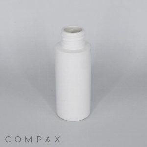 A white, cylindrical plastic bottle with a wide opening is centered against a plain, gray background. The word "COMPAX" is displayed in small, capitalized letters at the bottom-left of the image.