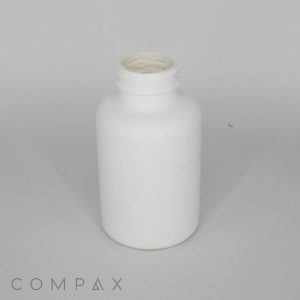 White plastic bottle with an open top, displayed against a plain light gray background. The image includes the brand name "COMPAX" in the bottom-left corner.