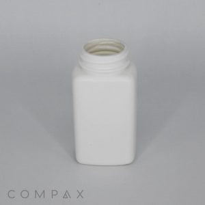 A white, rectangular plastic bottle with a screw-top lid, which is removed, showing an open mouth. The bottle sits on a plain, light grey background. There is a watermarked "COMPAX" logo in the bottom left corner.