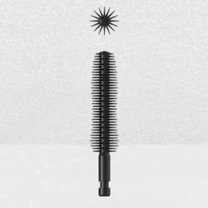 Image of a Plastic Brush Applicator vertically positioned against a plain light gray background. The applicator is capped with a cylindrical brush featuring many tiny bristles, and a starburst pattern of bristles is shown above the wand.