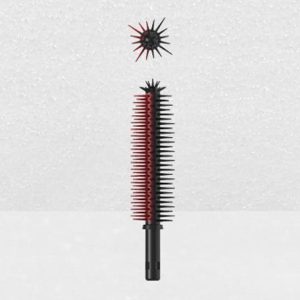 A vertically standing cylindrical Plastic Brush Applicator in black and red, featuring a spiked ball on top, set against a light textured background.