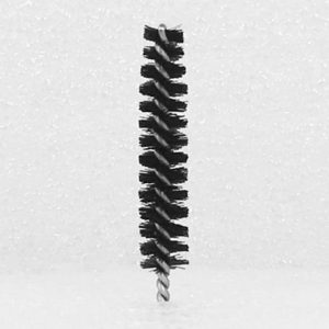 A Nylon Brush Applicator with tightly coiled bristles and a twisted metal handle, standing vertically against a plain white background. The densely packed and evenly spaced bristles encircle the handle.