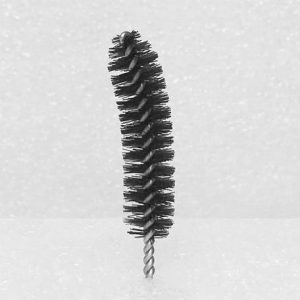 A `Nylon Brush Applicator` with dense bristles and a metal twisted handle stands upright against a plain white background. The black cylindrical brush features a slight curve to its shape.