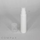 A white, cylindrical pump bottle with a clear plastic cap off and placed beside it, standing on a plain gray surface. The logo "COMPAX" is visible in the bottom left corner.