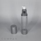 A clear, cylindrical pump bottle with a silver base and cap. The cap is removed, placed beside the bottle, and reveals a white pump dispenser. The background is plain, and the brand name "COMPAX" is visible in the bottom left corner.