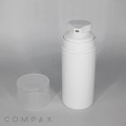 A white cylindrical pump dispenser with a clear cap placed beside it. The dispenser has a small rectangular nozzle on its top. The background is plain and light gray. The word "COMPAX" is written at the bottom left corner.