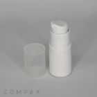 A white plastic pump bottle with a detached clear plastic cap placed next to it. The image background is plain and gray, with the word "COMPAX" faintly visible at the bottom.