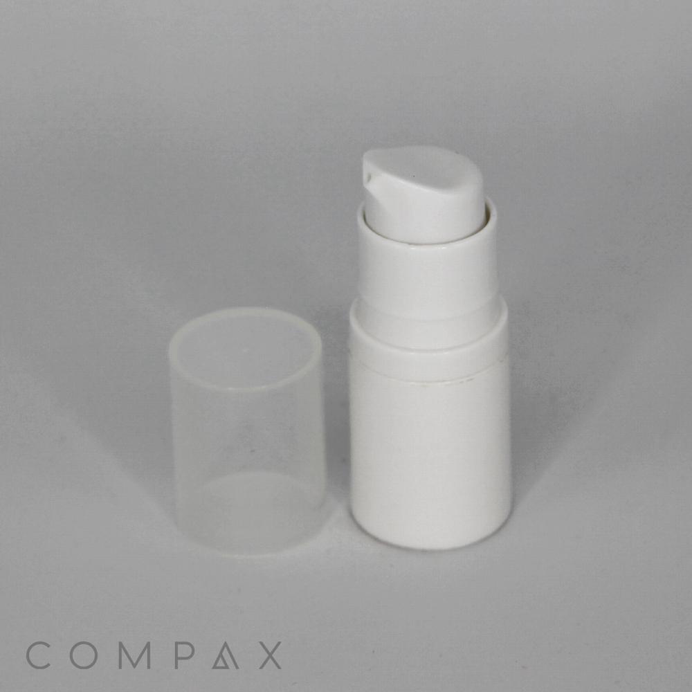 A white plastic pump bottle with a detached clear plastic cap placed next to it. The image background is plain and gray, with the word "COMPAX" faintly visible at the bottom.