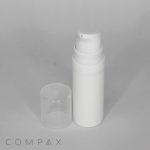 A white cylindrical pump bottle called the "All PP Round Airless Bottle with Pure Pump Spring" is positioned upright against a plain background. The clear removable cap is placed next to the bottle. The word "COMPAX" is written at the bottom-left corner of the image.