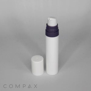 A white cylindrical Mini PP Airless Pump Bottle with a black Pure Pump Spring and a white cap placed beside it on a plain white background. "COMPAX" is printed in light grey letters at the bottom left corner of the image.