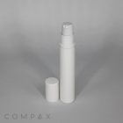 A white cylindrical bottle with a pump dispenser and a removable cap standing on a gray surface. The bottle is upright, and the cap is placed in front of it. The word "COMPAX" is faintly visible in the bottom left corner.
