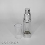 A transparent, cylindrical cosmetic airless pump bottle with a silver pump and base. The bottle is standing upright with its clear cap removed and placed beside it. The brand name "COMPAX" is displayed in small letters at the bottom.

Product Data:
  Product Name: Round Airless Pump Bottle

Rewritten Sentence:
The Round Airless Pump Bottle features a transparent, cylindrical design with a silver pump and base. It stands upright with its clear cap removed and placed beside it, showcasing the brand name "COMPAX" in small letters at the bottom.