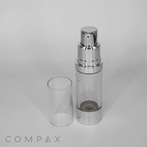 A transparent, cylindrical cosmetic airless pump bottle with a silver pump and base. The bottle is standing upright with its clear cap removed and placed beside it. The brand name "COMPAX" is displayed in small letters at the bottom.

Product Data:
  Product Name: Round Airless Pump Bottle

Rewritten Sentence:
The Round Airless Pump Bottle features a transparent, cylindrical design with a silver pump and base. It stands upright with its clear cap removed and placed beside it, showcasing the brand name "COMPAX" in small letters at the bottom.