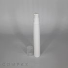 Image of a tall, slender, white pump bottle with a transparent cap placed beside it. The bottle stands upright against a plain, gray background. The word "COMPAX" is subtly displayed in light gray text at the bottom left corner of the image.