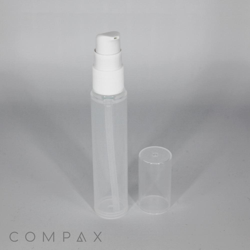 A clear plastic spray bottle, the PP Airless Pump Bottle, stands upright with a white pump nozzle. The translucent cap, removed from the nozzle, is placed next to the bottle. The bottle has a minimalistic design, and the word "COMPAX" is partially visible in the bottom left corner.
