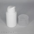 A PP Round Airless Pump Bottle with an open nozzle is placed alongside a clear, cylindrical cap. The background features a plain, light gray surface. The word "COMPAX" is printed in faint, gray letters on the lower-left corner of the image.
