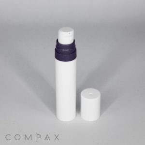 A Mini PP Airless Pump Bottle with Pure Pump Spring, featuring a white cylindrical body and a dark purple cap, stands upright against a grey background. The cap is removed and placed beside the bottle, revealing a white dispensing nozzle. The word "COMPAX" is partially visible in the bottom left corner.