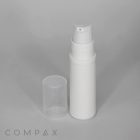A white plastic foam pump bottle with a clear cap placed beside it. The bottle has a cylindrical shape and a nozzle for dispensing liquid or foam. The background is plain gray, and the word "COMPAX" is visible in the bottom left corner.