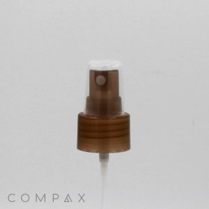 A close-up of the Sprayer's brown nozzle with a transparent cap reveals a small white spray head in the center. The word "COMPAX" is printed in gray text at the bottom left corner against a white background.