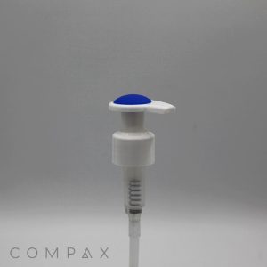 A white plastic pump with a silicone top and spring mechanism is pictured against a plain gray background. The brand name "COMPAX" is visible in faded letters at the bottom left corner of the image.