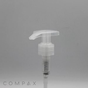 A close-up image of a transparent plastic pump dispenser set against a plain grey background. The base of the pump displays the brand name "COMPAX" in grey lettering and is labeled as the "Large Teardrop Pump.