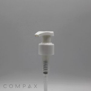 A white plastic Pump with a spring mechanism is centered against a plain gray background. The word "COMPAX" is faintly visible in the lower-left corner of the image.