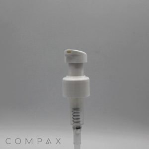 A close-up of the white plastic Sleek Pump dispenser against a gray background. The lower part of the pump showcases a transparent spring, and the text "Compax" is positioned at the bottom left corner of the image.