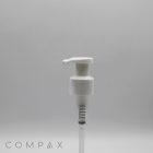 A white Teardrop Pump dispenser set against a plain grey background. The pump features a long nozzle and a spring mechanism visible inside the transparent lower portion. The word "COMPAX" is faintly visible in the bottom-left corner.