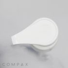 Overhead view of a white plastic Teardrop Pump dispenser on a light background. The dispenser is closed, and the brand name "COMPAX" is visible in grey text near the bottom left corner.