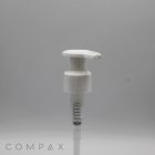 A white Hook Pump dispenser made of plastic is set against a gray background. The dispenser features a small lever on top for dispensing liquid and a visible spring mechanism inside. The word "COMPAX" is printed in light letters at the bottom left corner of the image.