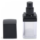 A square, transparent Square Double Wall Airless Bottle with a black spray nozzle top, shown with its black cap removed and placed beside it to the left. The bottle is empty, and the brand name "COMPAX" is partially visible in the lower-left corner of the image.