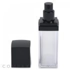 A square Double Wall Airless Bottle made of clear plastic with a black pump dispenser and a matching black cap placed next to it. The container appears to be for cosmetic or skincare products. The brand name "COMPAX" is visible at the bottom of the image.