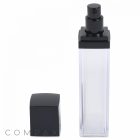A clear square Double Wall Airless Bottle with a sleek black dispenser and a matching black cap placed beside it. The bottle is empty and stands upright on a plain white background. The brand name "COMPAX" is faintly visible in the bottom left corner.