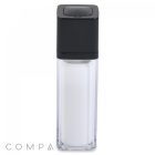 A Square Double Wall Airless Bottle with a clear rectangular body and a black square cap. The bottle's transparency reveals a white interior cylinder, and the brand name "COMPA" is faintly visible at the bottom left corner.