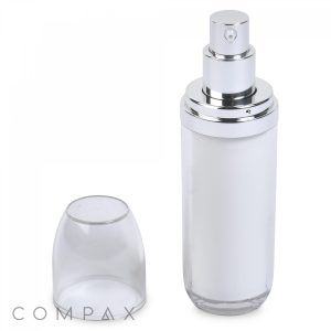 A sleek, transparent spray bottle, named the Double Wall Airless Bottle, with silver accents and a cylindrical shape, showcased with its clear cap removed and placed beside it. The bottle's top features a silver pump dispenser for easy application. The word "COMPAX" is visible in the lower-left corner.