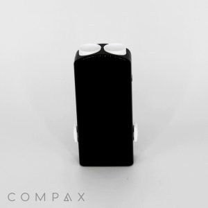 A sleek, rectangular, black device identified as the Rectangular Dual Slide up Lipstick features two white buttons on the top and two white knobs on the sides. Positioned vertically against a white background, the image showcases the brand name "COMPAX" at the bottom left corner.
