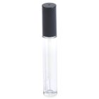 A clear 5mL lip gloss bottle with a black cap, labeled "COMPAX" near the bottom, is standing upright against a white background.