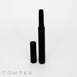 A sleek black Round Twist Up Pencil with a detached cap placed beside it against a plain white background. The brand name "COMPAX" is visible at the bottom left corner.