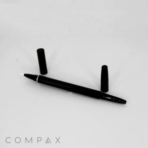 A black Round Dual Pen with its cap removed lies on a white surface, revealing the pen's tip. The pen's cap is positioned upright to the top right and left of the pen. The brand name "COMPAX" is visible in the bottom left corner.
