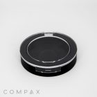 A Single Well Round Compact case, featuring a black base and a transparent lid, sits on a plain white background. The word "COMPAX" is printed in gray text in the bottom left corner of the image.