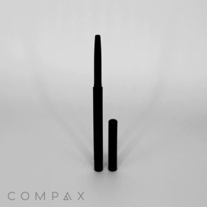 A Dual Round Twist-up Pencil with Blender Sponge, with its cap removed, is standing upright on a plain white background. The cap is placed standing next to the pencil. The brand name "COMPAX" is visible in light gray text at the bottom left corner of the image.
