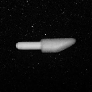 A Nylon Flocking Applicator, white and elongated like a turned-off rocket or missile, is suspended against a black, star-speckled background. The applicator has a blunt tip on one end and a cylindrical shape extending from it.