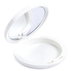 A round white Single Well Round Compact with Mirror is shown with its lid open. Inside the top lid, there's a mirror. The bottom part of the case is empty, and the brand name "COMPAX" is printed in gray letters at the bottom left corner of the image.