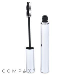 A Round Mascara Bottle is shown with its cap removed, revealing the black mascara brush wand. The tube and wand are both sleek and shiny. The word "COMPAX" is displayed in the bottom left corner of the image.