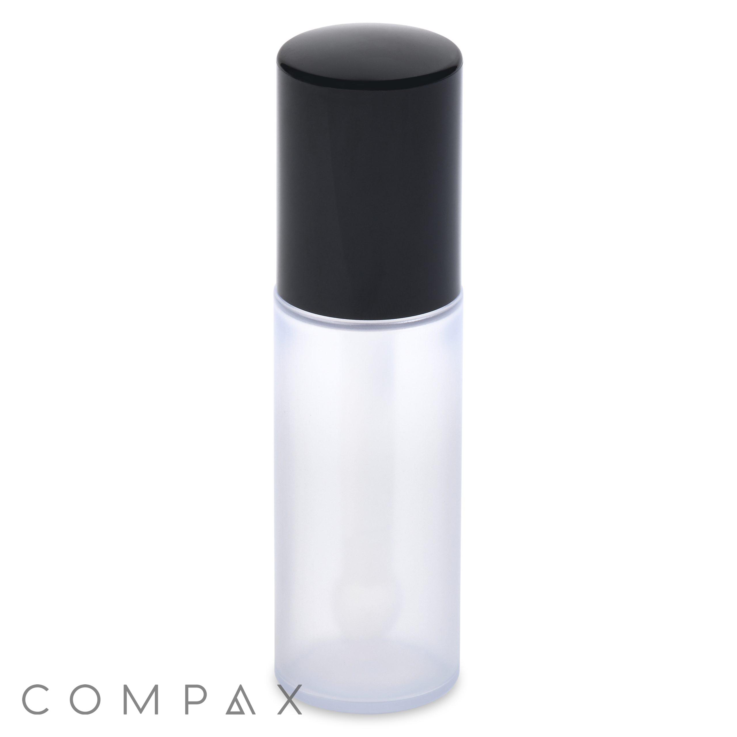 A mini round frosted plastic cosmetic bottle with a black cap, displayed against a white background. The word "COMPAX" is written in thin, gray letters at the bottom left corner of the image.