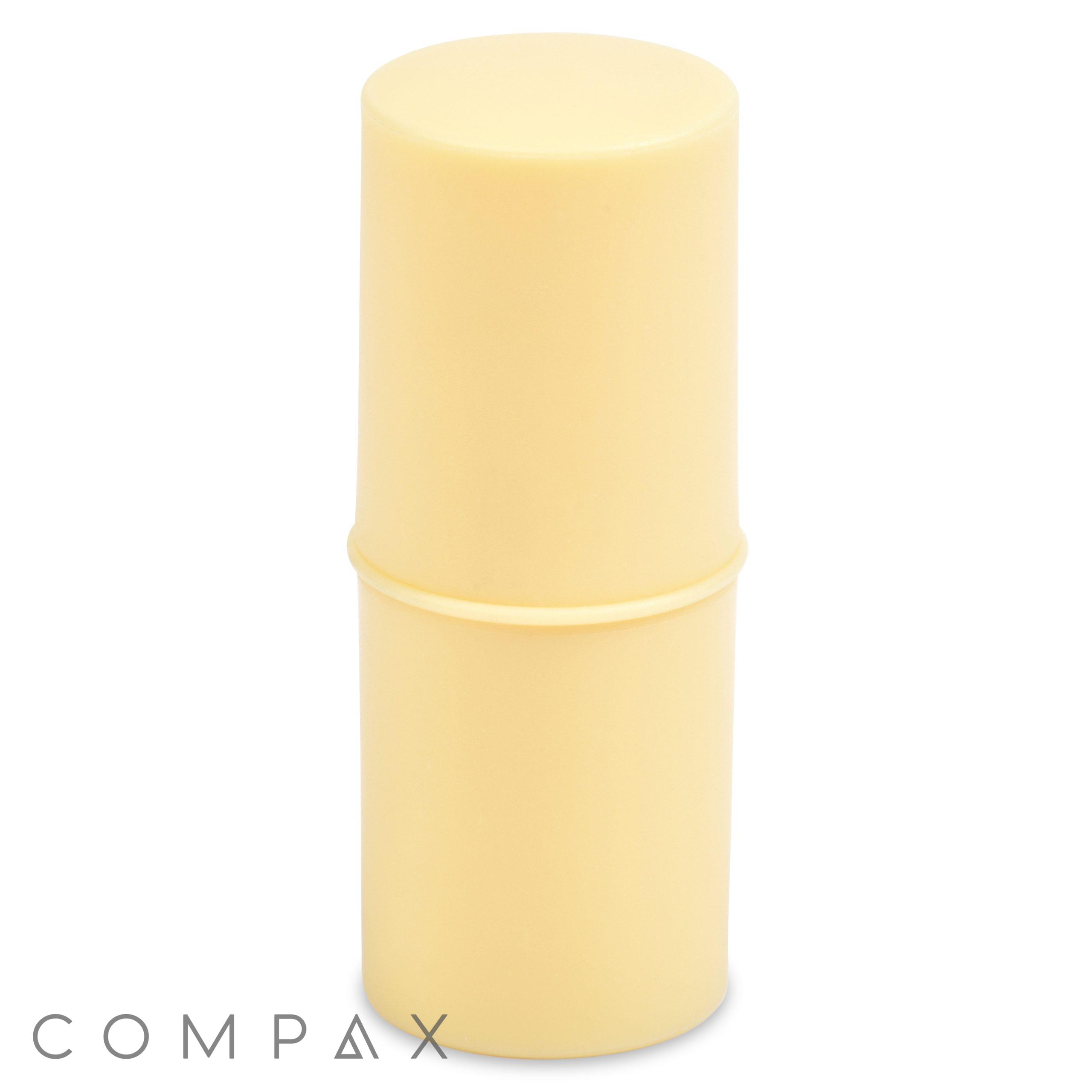 A cylindrical, pale yellow plastic container with a lid, standing upright against a white background. The word "Mini Stick" is written in gray at the bottom left corner of the image.